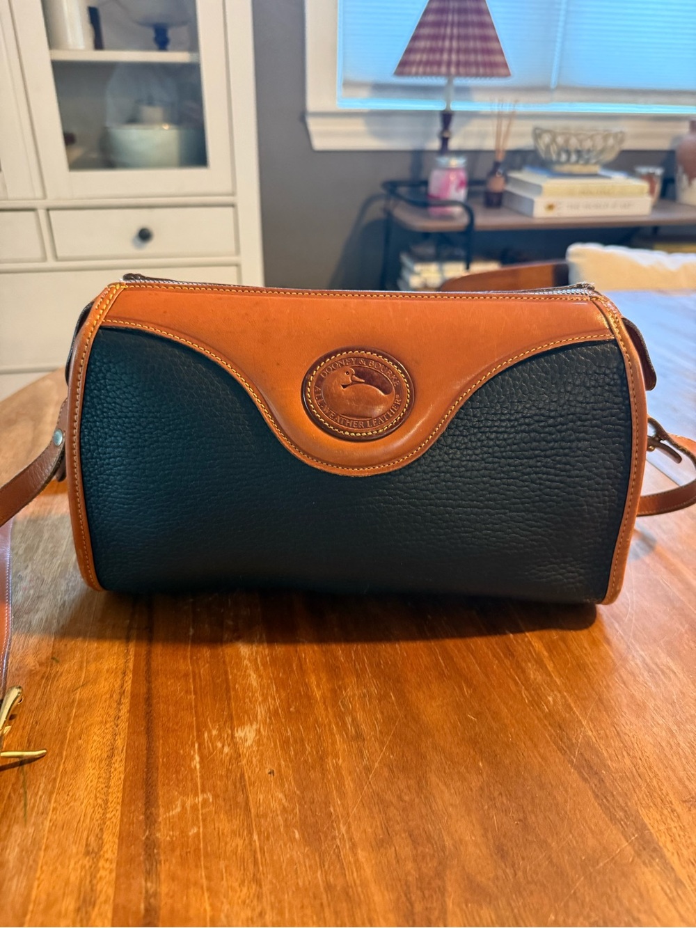 Dooney & Bourke Black and Tan Pebbled Leather Toiletry Crossbody